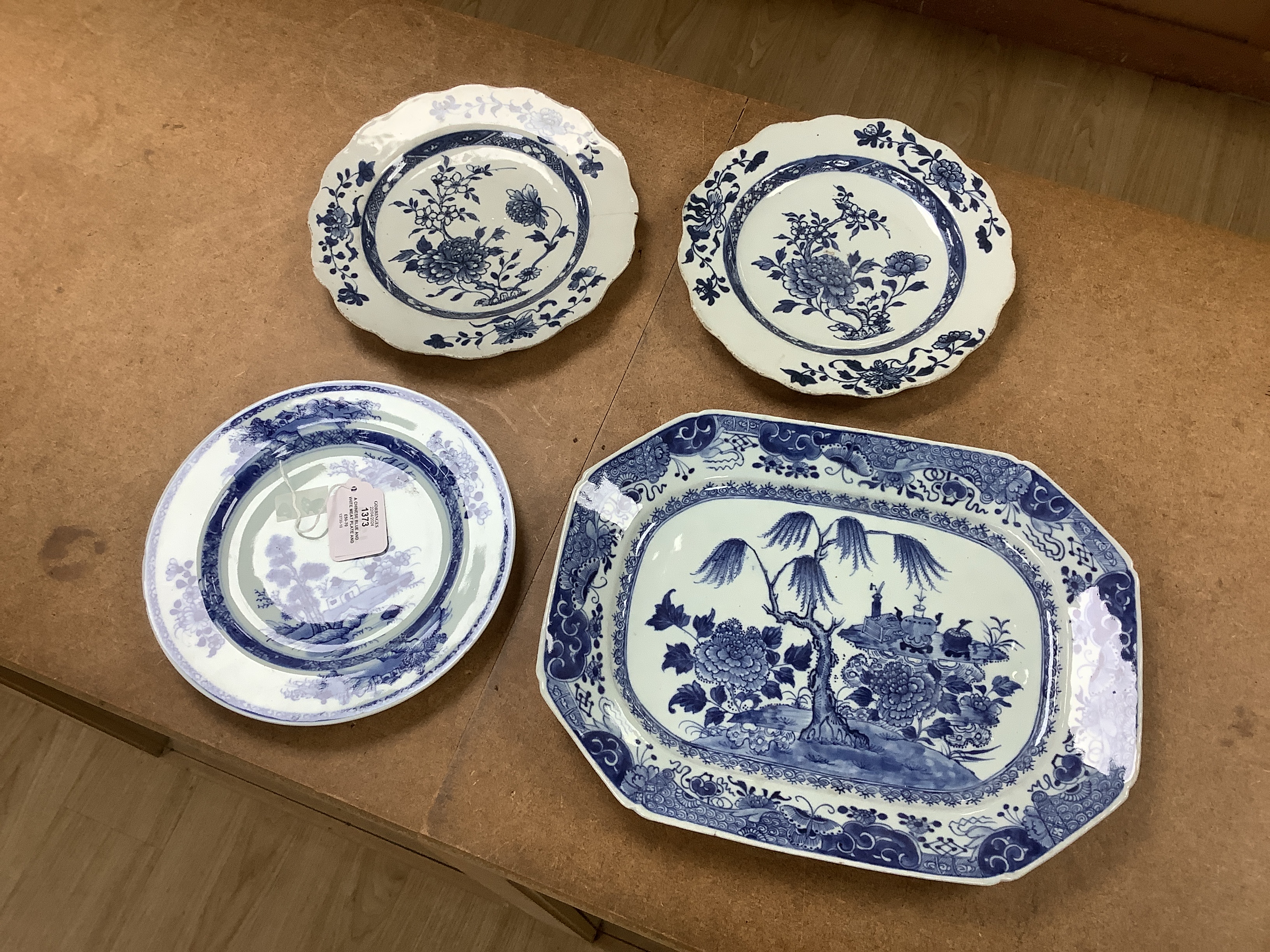 A Chinese blue and white meat plate and three plates, 18th century, meat plate 35cm wide